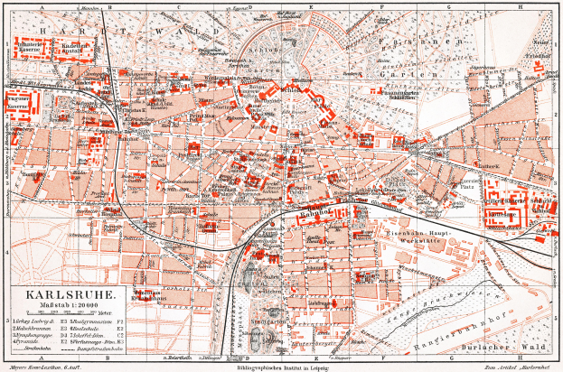 Ein detaillierter Stadtplan von Karlsruhe, Deutschland aus dem Jahr 1900, mit Text und umfassender Stadtansicht.