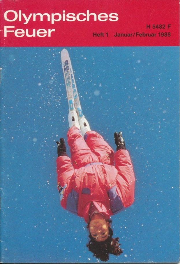 Titelbild von 'Olympische Spiele Feuer - Heft 1 - Januar/Februar 1988' mit einem Skifahrer in der Luft in einem Ski-Anzug.