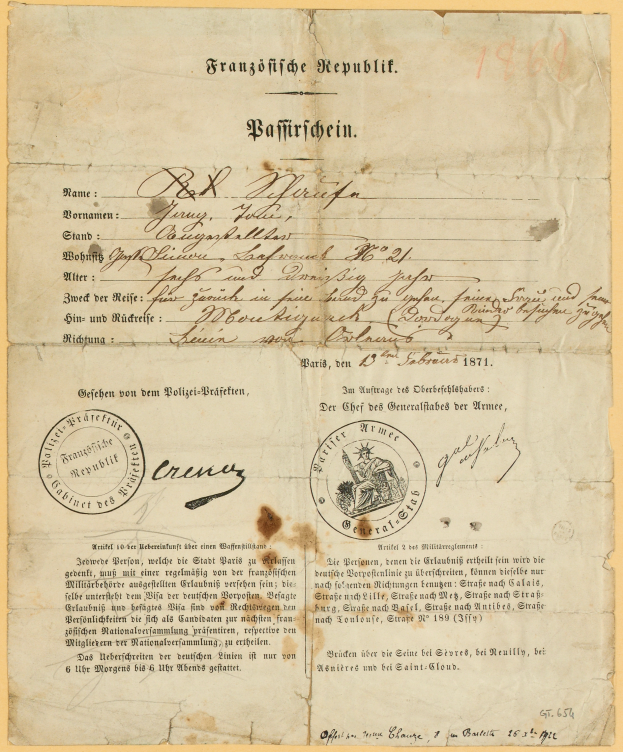 Ein altes, vergilbtes Dokument mit einem kreisrunden, schwarz umrandeten Stempel, enthält schwarzen Text, wahrscheinlich ein Brief der deutschen Regierung.