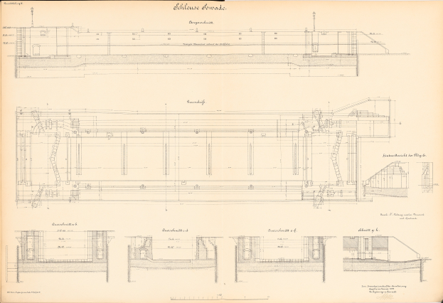 A detailed drawing of a train, including its engine and transmission, on the cover of an old book with accompanying text about the train's history.