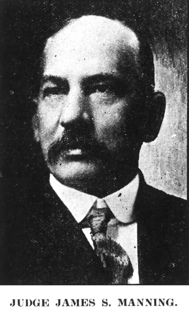 Black and white portrait of Judge James S. Manning in a suit and tie, with text at the bottom reading "Judge James S Manning".