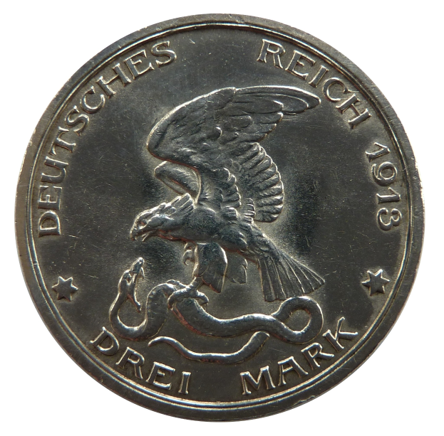 Silbermünze mit einem Adler, der eine Schlange umklammert, mit ausgebreiteten Flügeln und der Inschrift "Deutsches Reich" auf einem weißen Hintergrund.